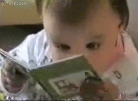 Baby intensely reading book giphy